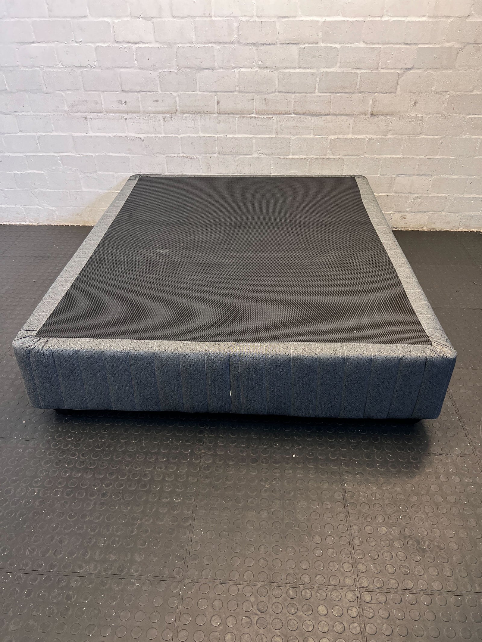Comfortable Grey Fabric Bed Frame with Minor Wear