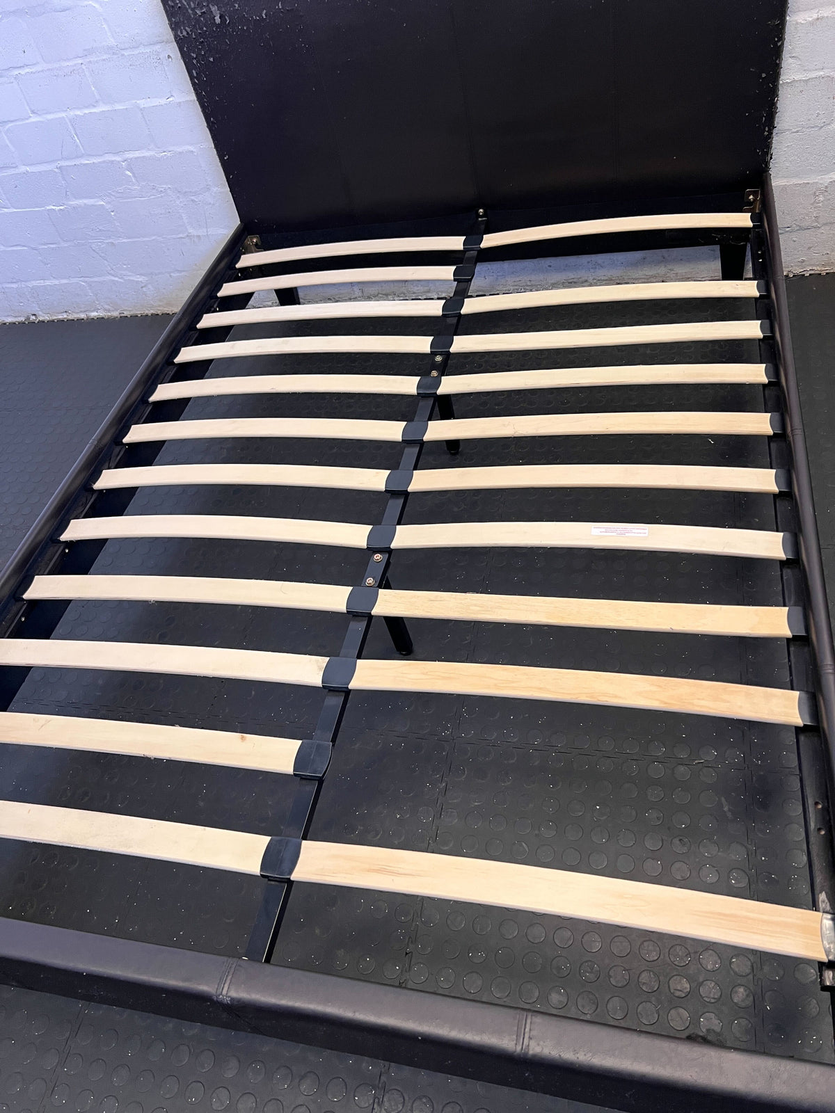 Sleek Black Upholstered Double Bed Frame with Minor Wear - REDUCED