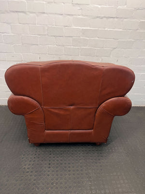 Classic Brown Leather Armchair with Intricate Detailing