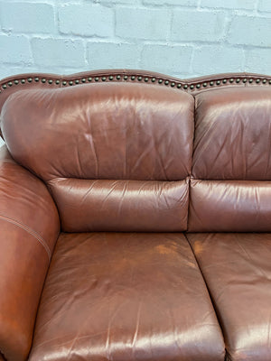 Classic Brown Leather Sofa with Wooden Accents