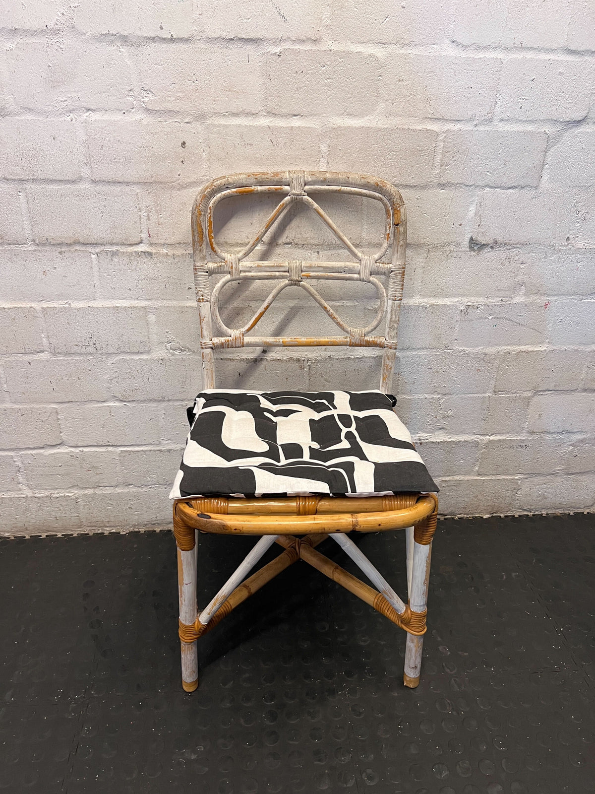 Distressed White Rattan Chair with Modern Graphic Cushion - 2ndhandwarehouse.com