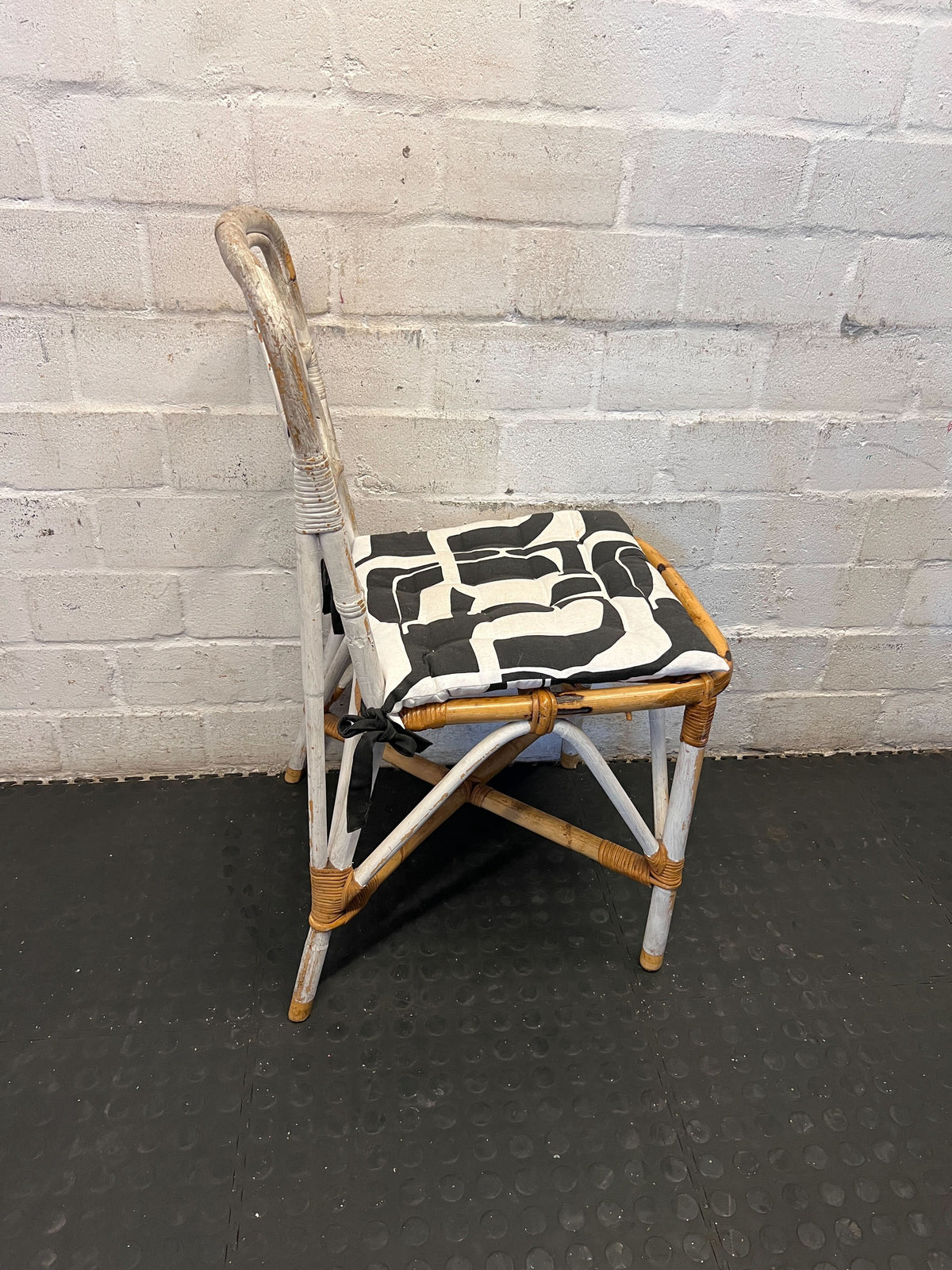 Distressed White Rattan Chair with Modern Graphic Cushion - 2ndhandwarehouse.com