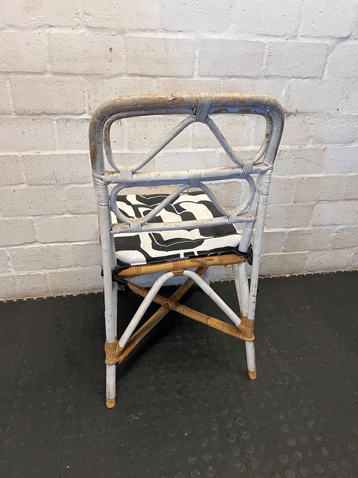 Distressed White Rattan Chair with Modern Graphic Cushion - 2ndhandwarehouse.com
