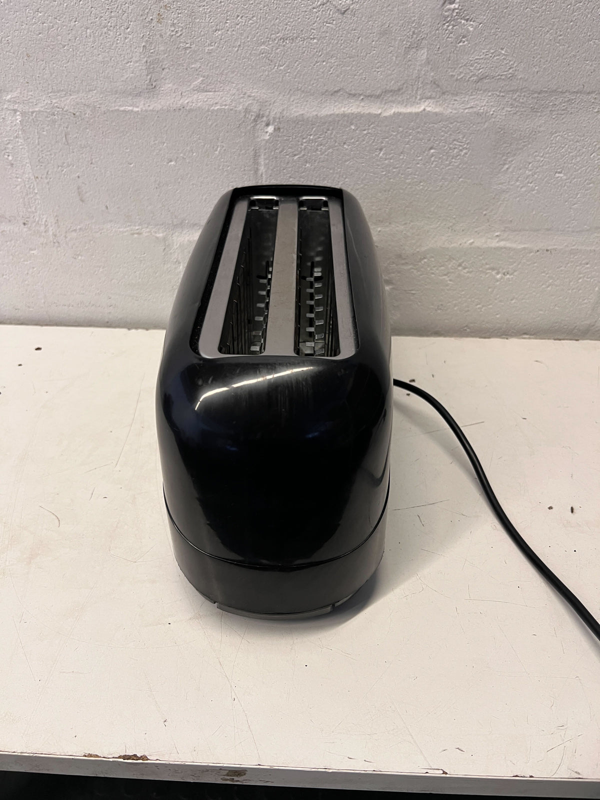 Stylish Black Two-Slice Toaster with Minor Scratches