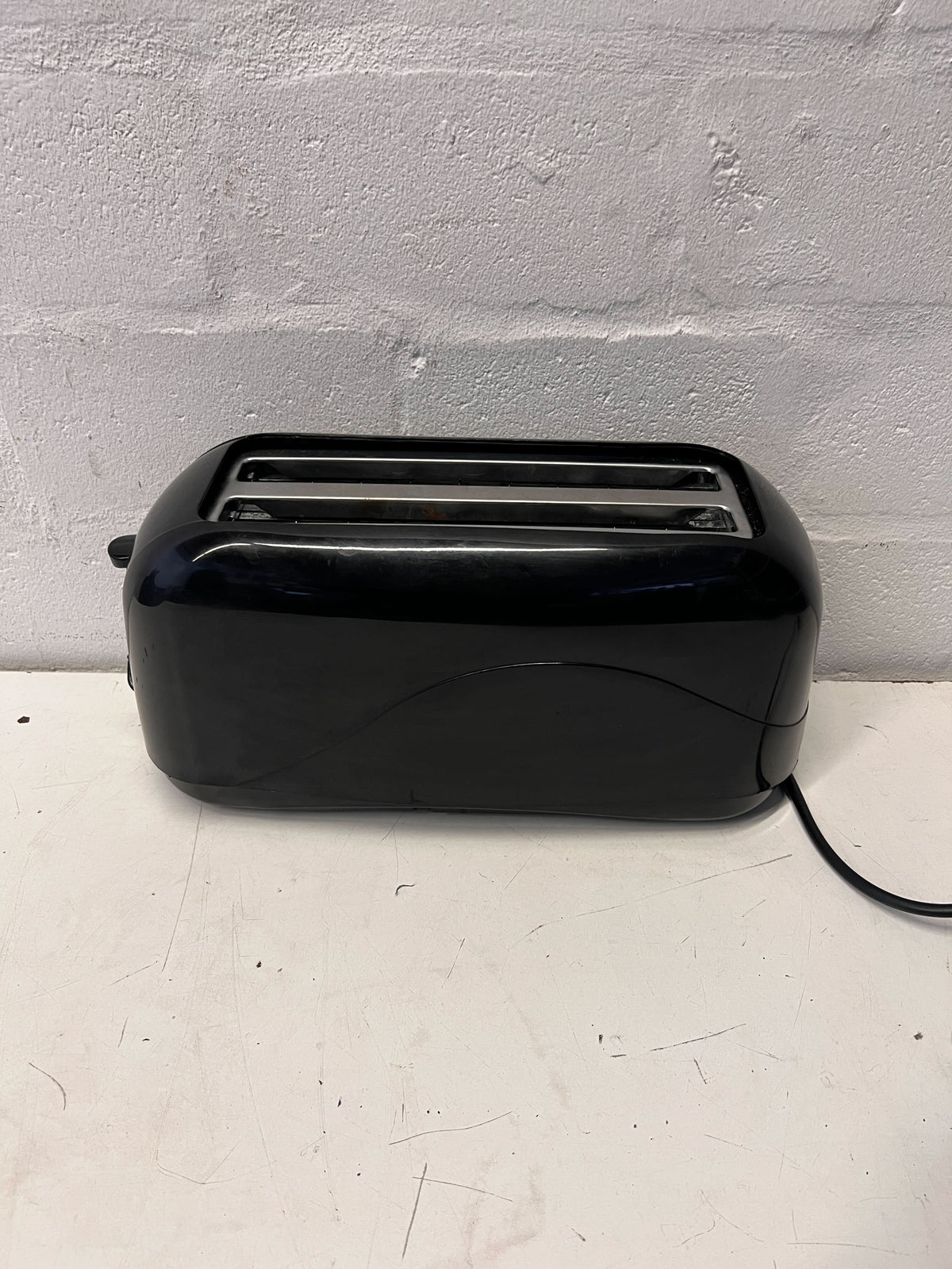 Stylish Black Two-Slice Toaster with Minor Scratches