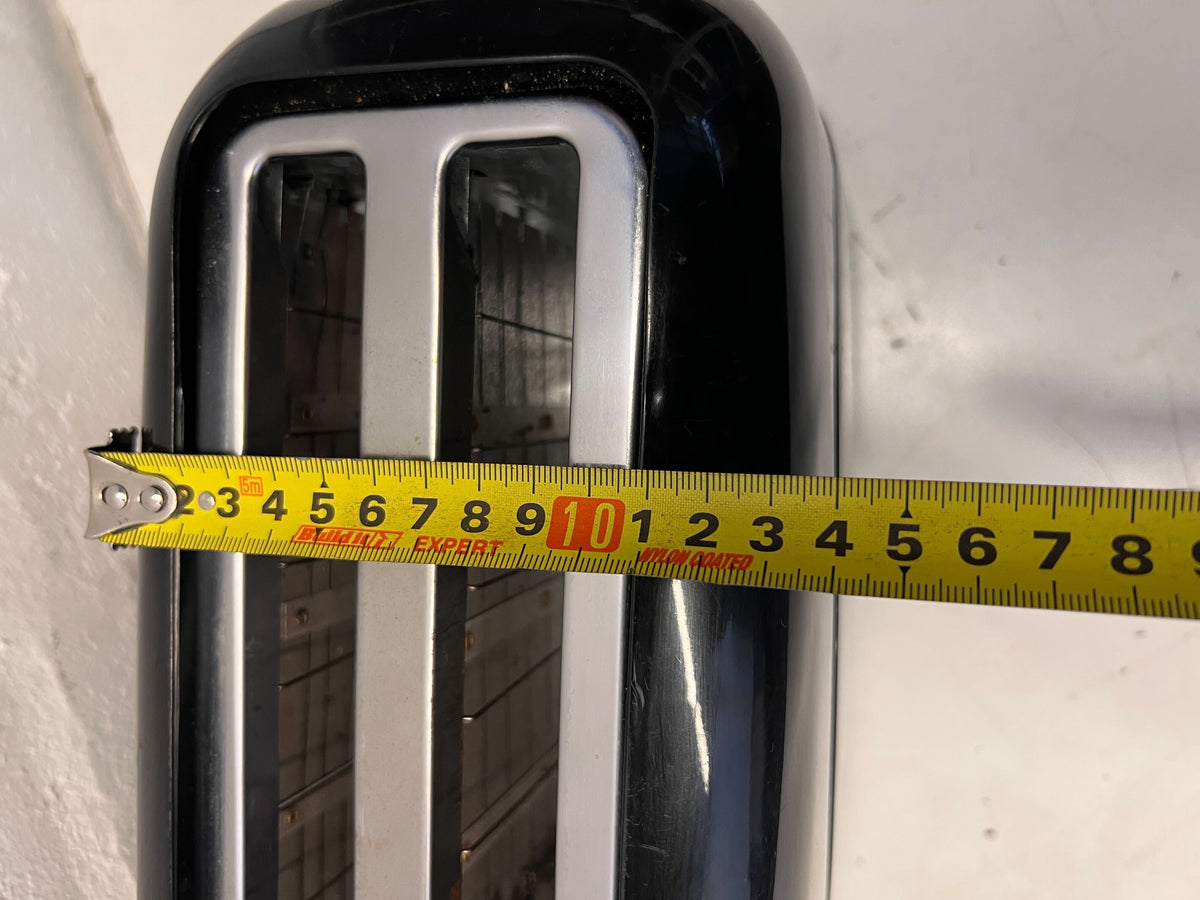 Stylish Black Two-Slice Toaster with Minor Scratches