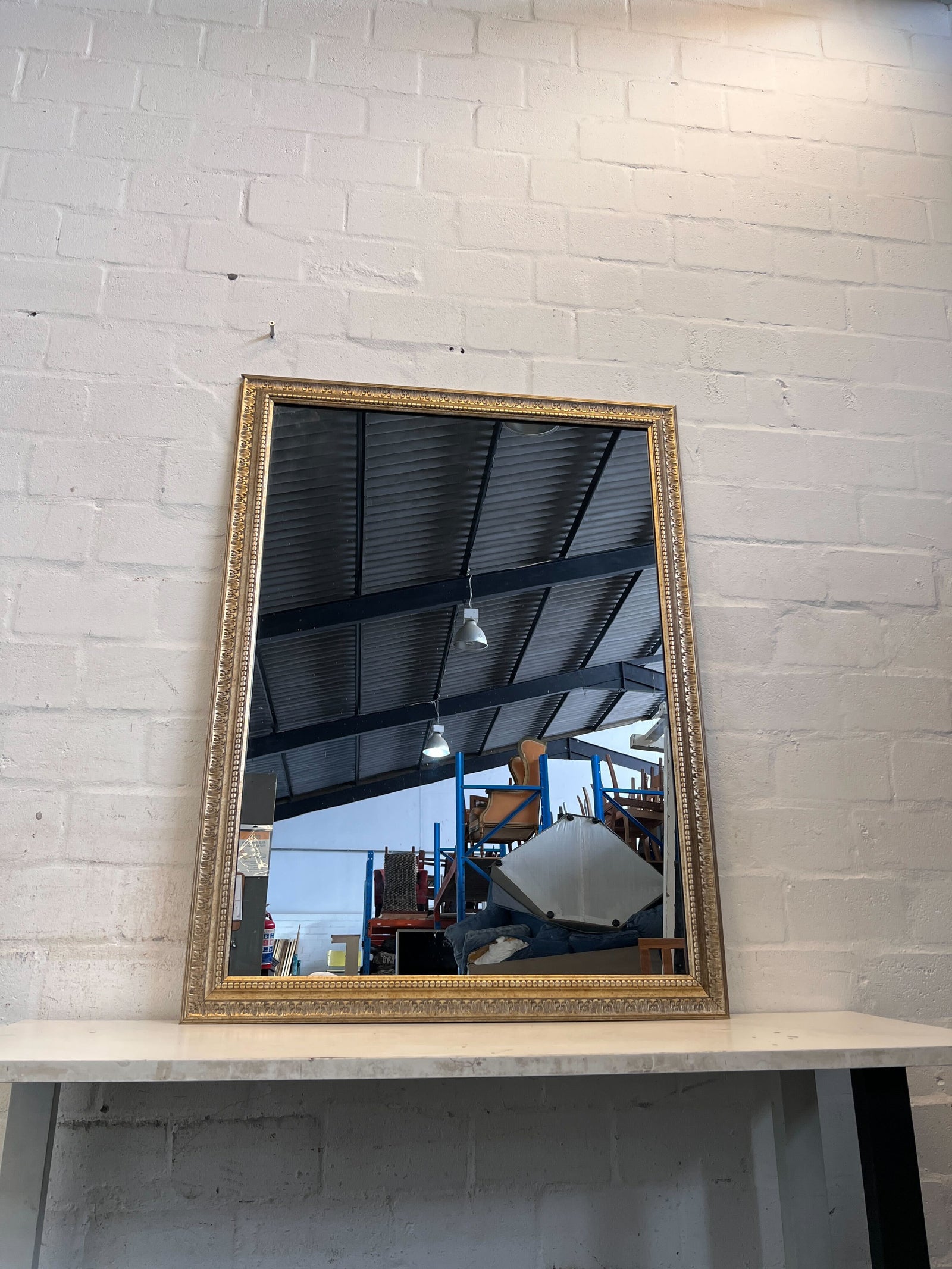 Elegant Gold-Framed Vintage Mirror with Minor Scratches