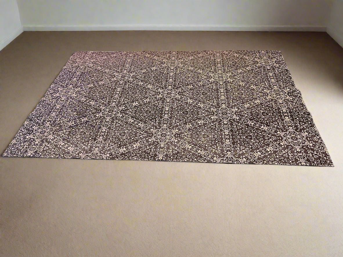 Textured mat on a black surface with a white brick wall background