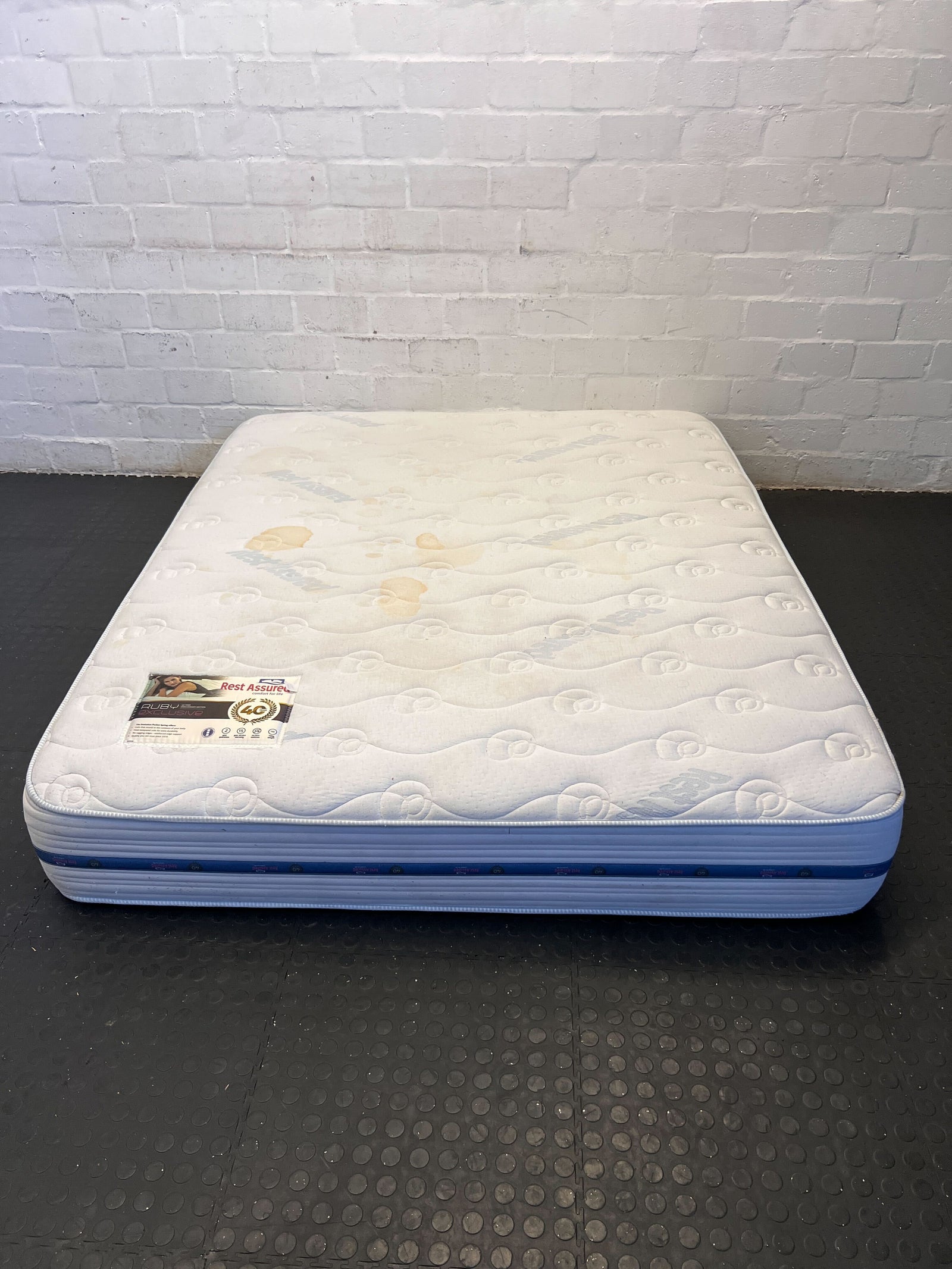 Comfortable Rest Assured Queen Mattress with Minor Stains