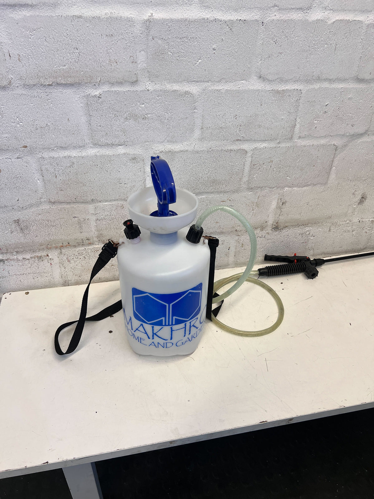 Versatile White Handheld Garden Sprayer with Blue Handle