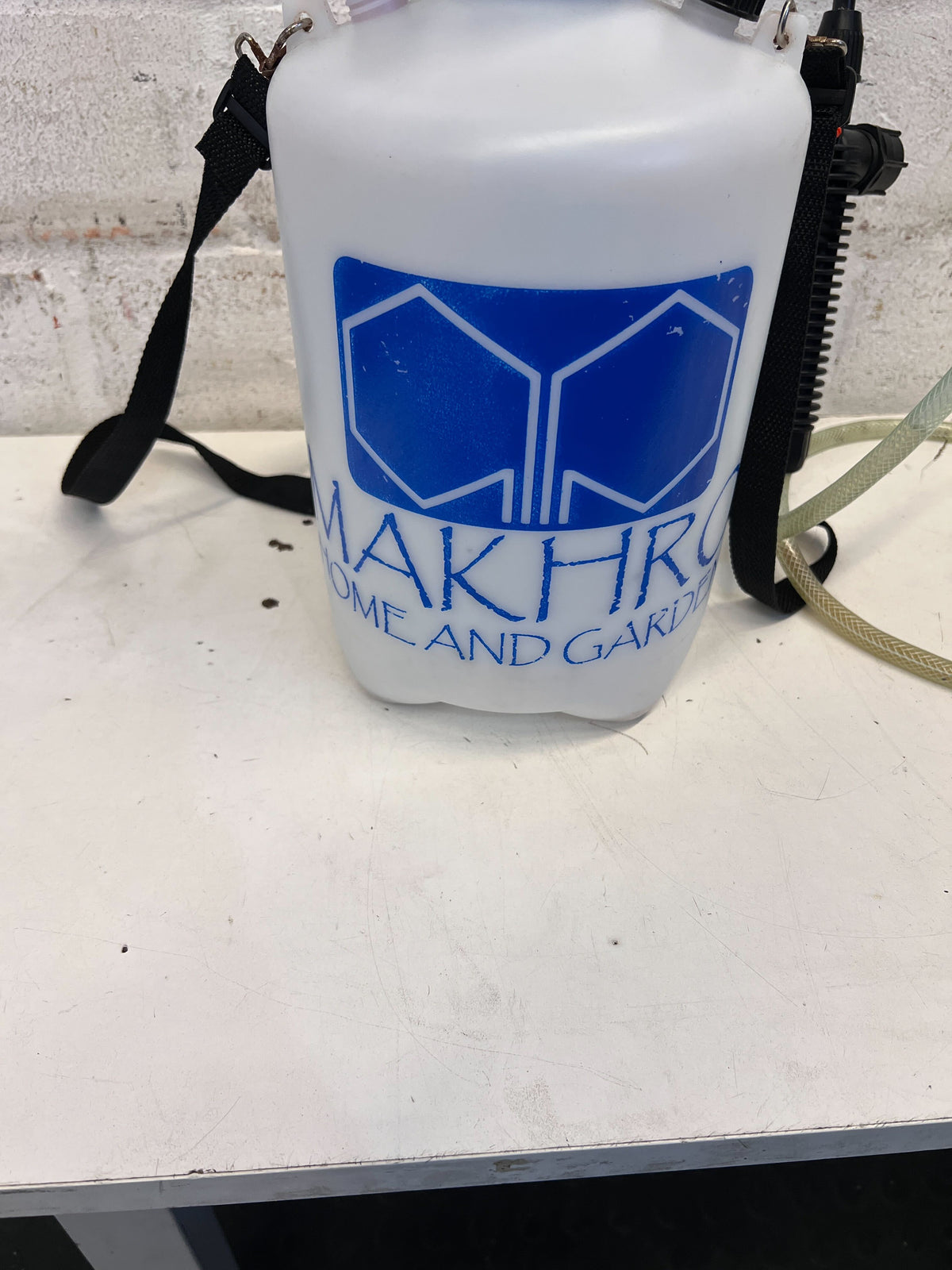 Versatile White Handheld Garden Sprayer with Blue Handle