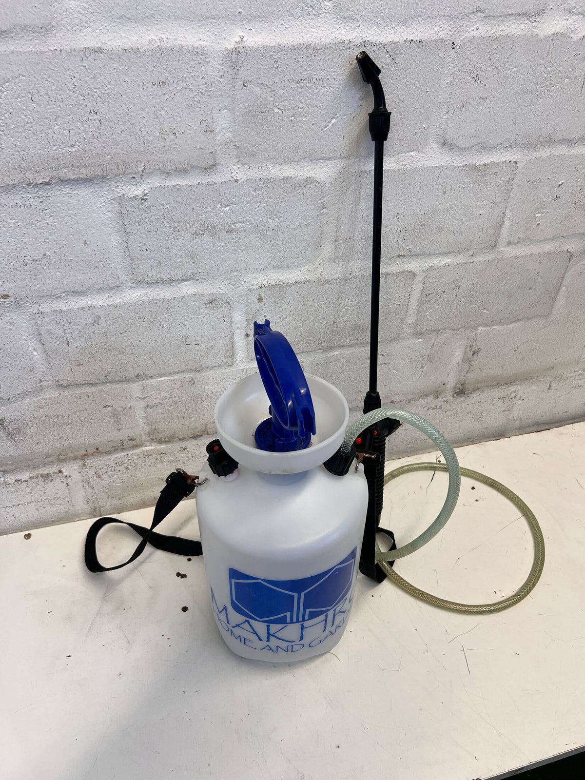 Versatile White Handheld Garden Sprayer with Blue Handle