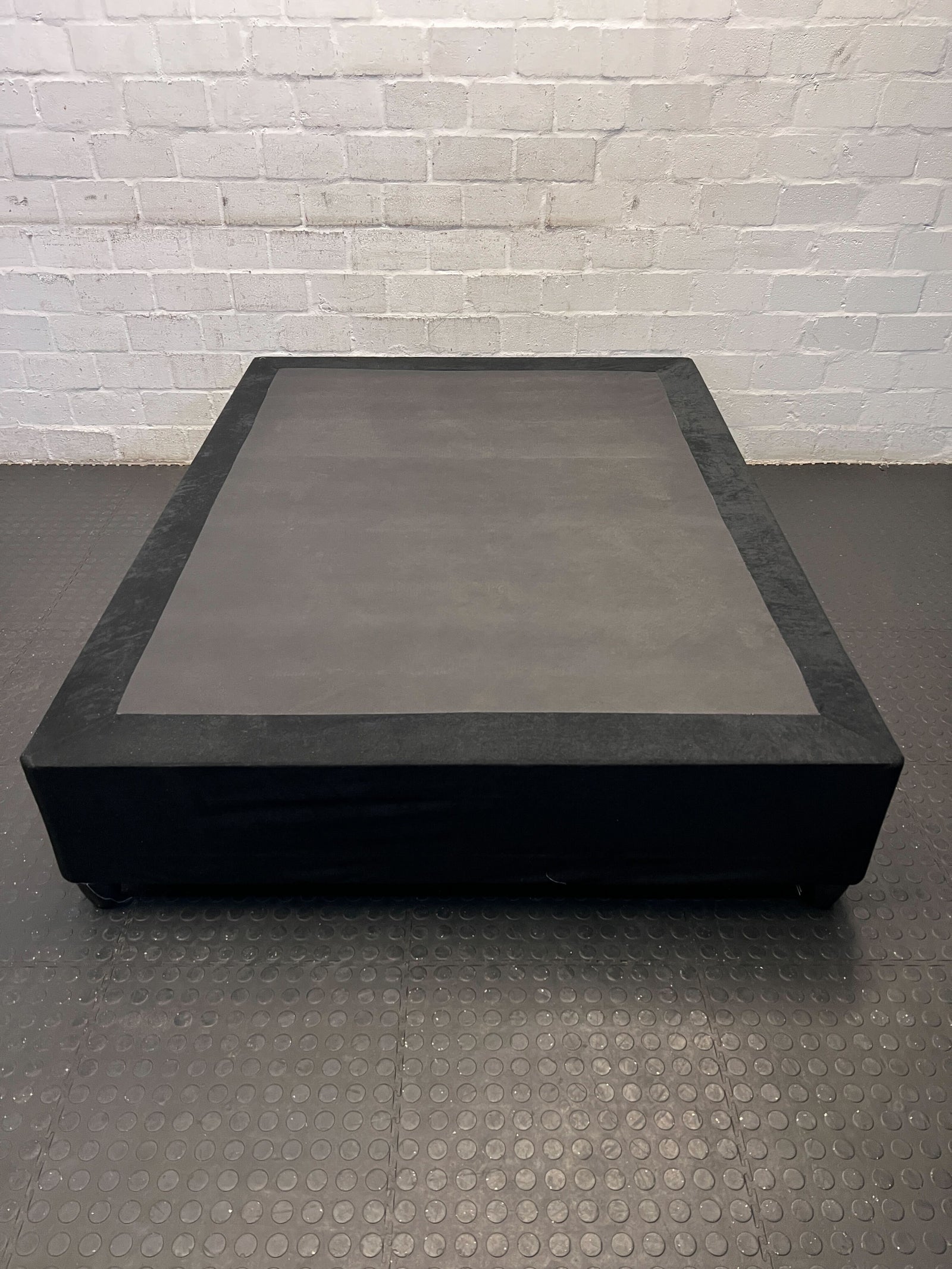 Modern Black Upholstered Double Bed Base with Minimal Wear