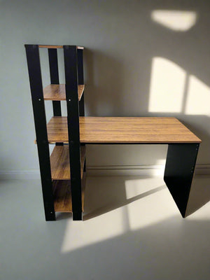 Wooden desk with black metal legs against a white wall