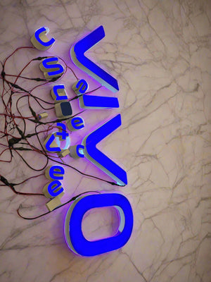 Neon sign with 'Vivo' logo on a marble background