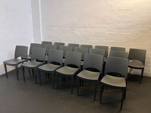 Modern Dark Grey Plastic Dining Chair with Minor Scratches