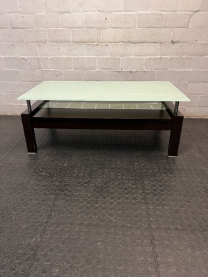 Modern Two-Tier Glass and Black Coffee Table — Well Used with Visible Wear