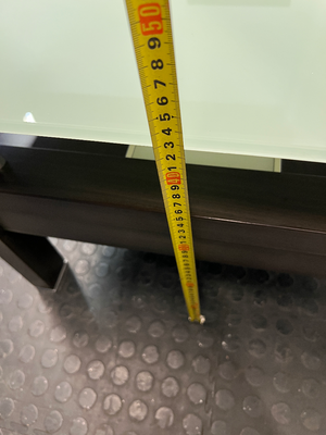 Modern Two-Tier Glass and Black Coffee Table — Well Used with Visible Wear