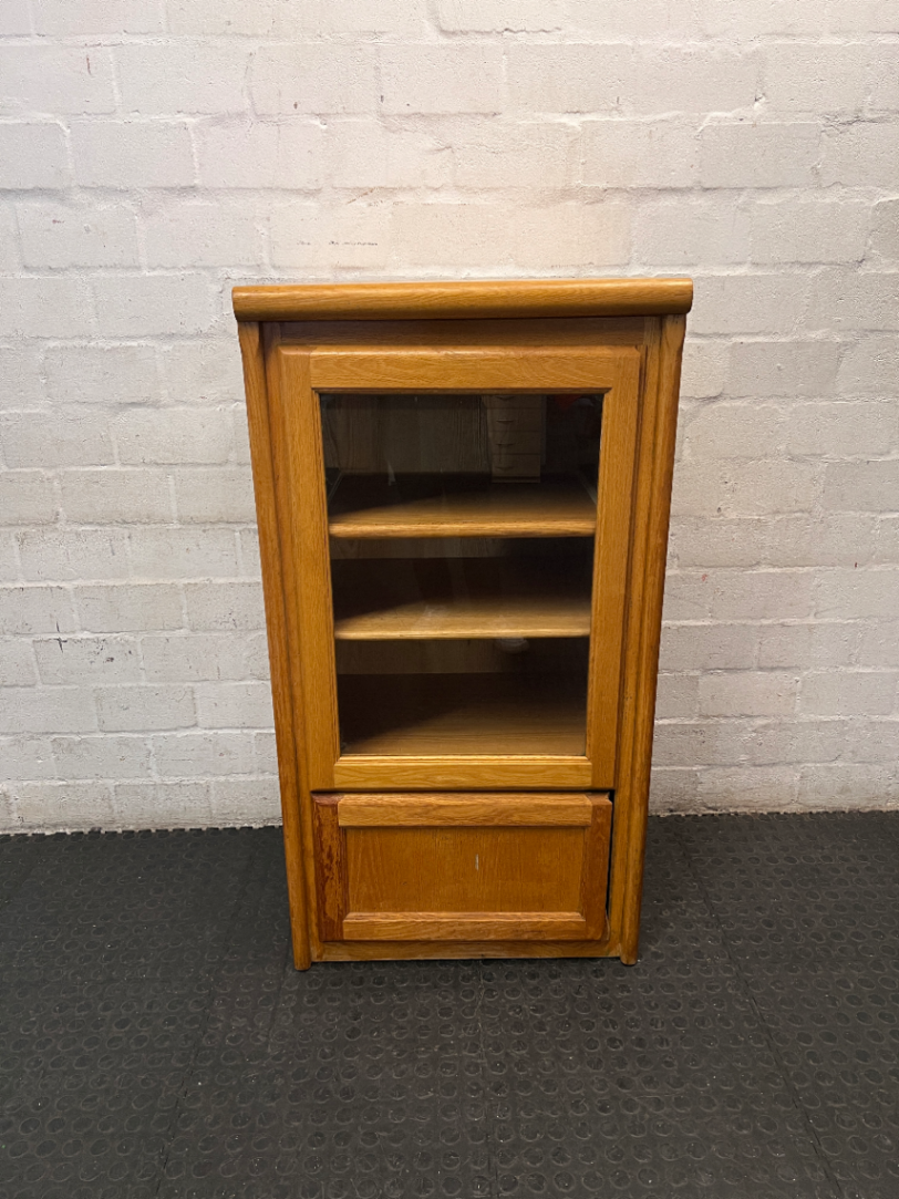 Oak-Toned Glass Door Display Cabinet with Drawer — Fair Condition with Visible Wear
