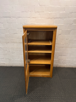 Oak-Toned Glass Door Display Cabinet with Drawer — Fair Condition with Visible Wear