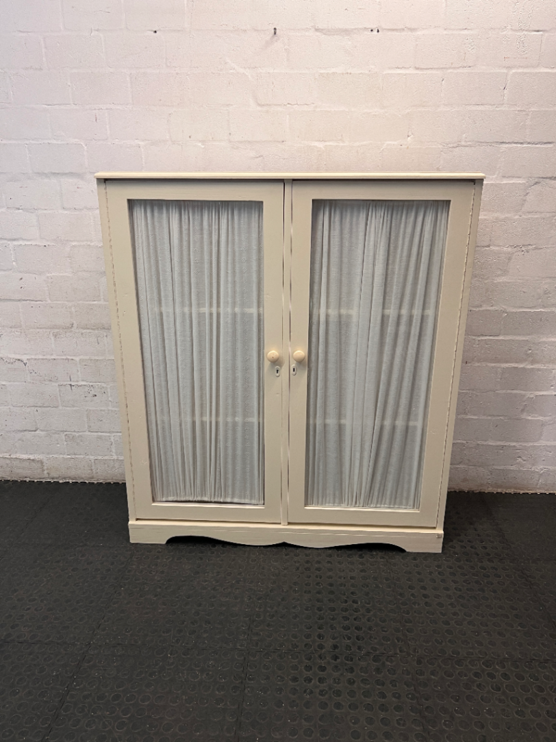 Off-White Wooden Storage Cupboard with Glass Inlay Doors — Fair Condition with Visible Wear
