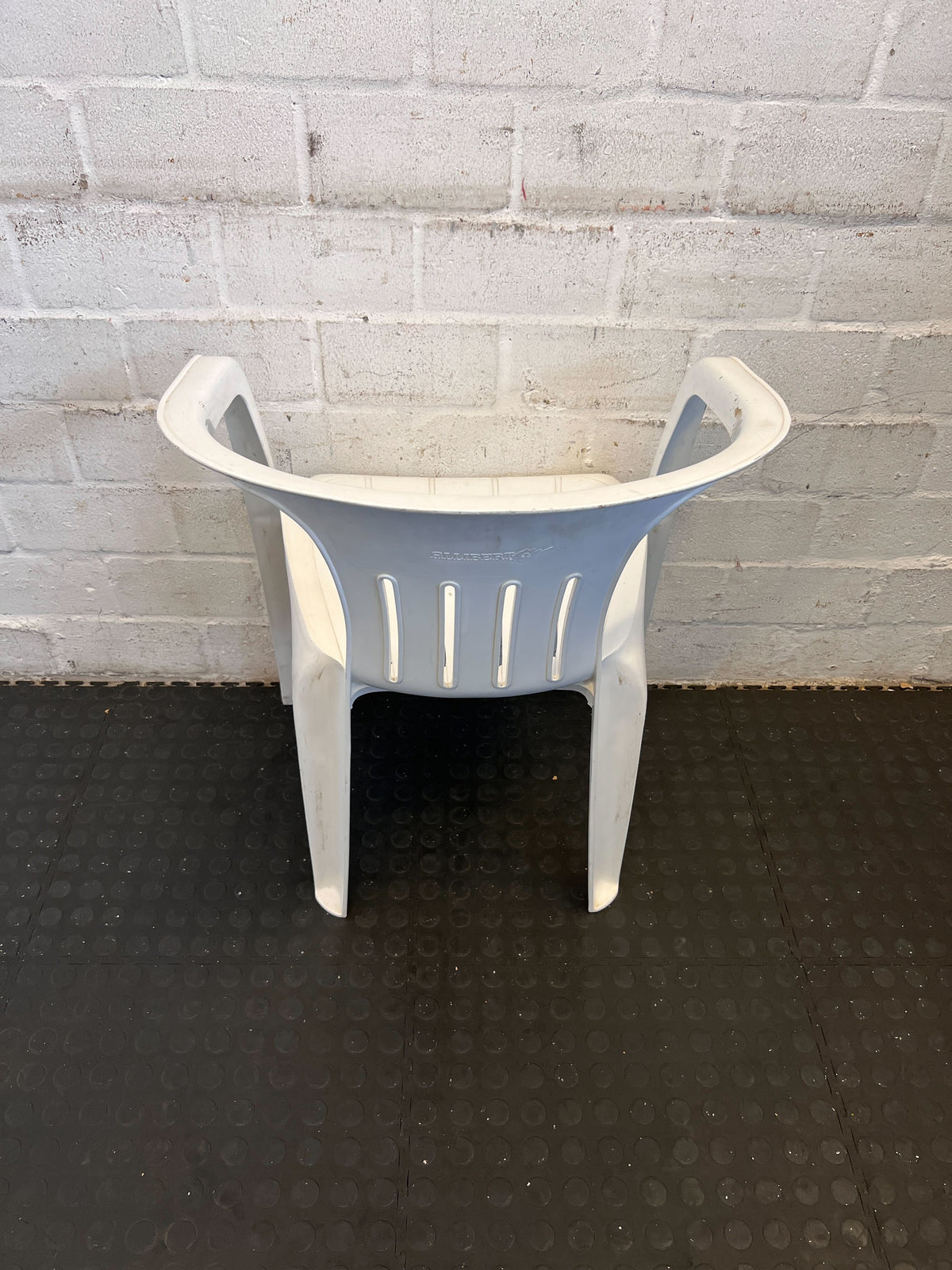 Practical White Plastic Garden Chair with Minor Scratches