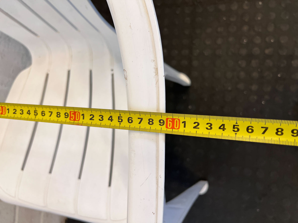 Practical White Plastic Garden Chair with Minor Scratches