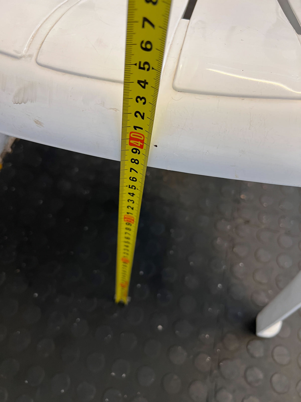 Practical White Plastic Garden Chair with Minor Scratches