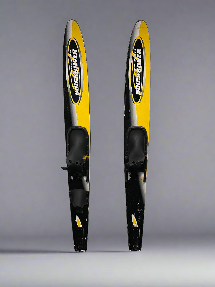 Two black and yellow water skis with a brand logo on a gray background