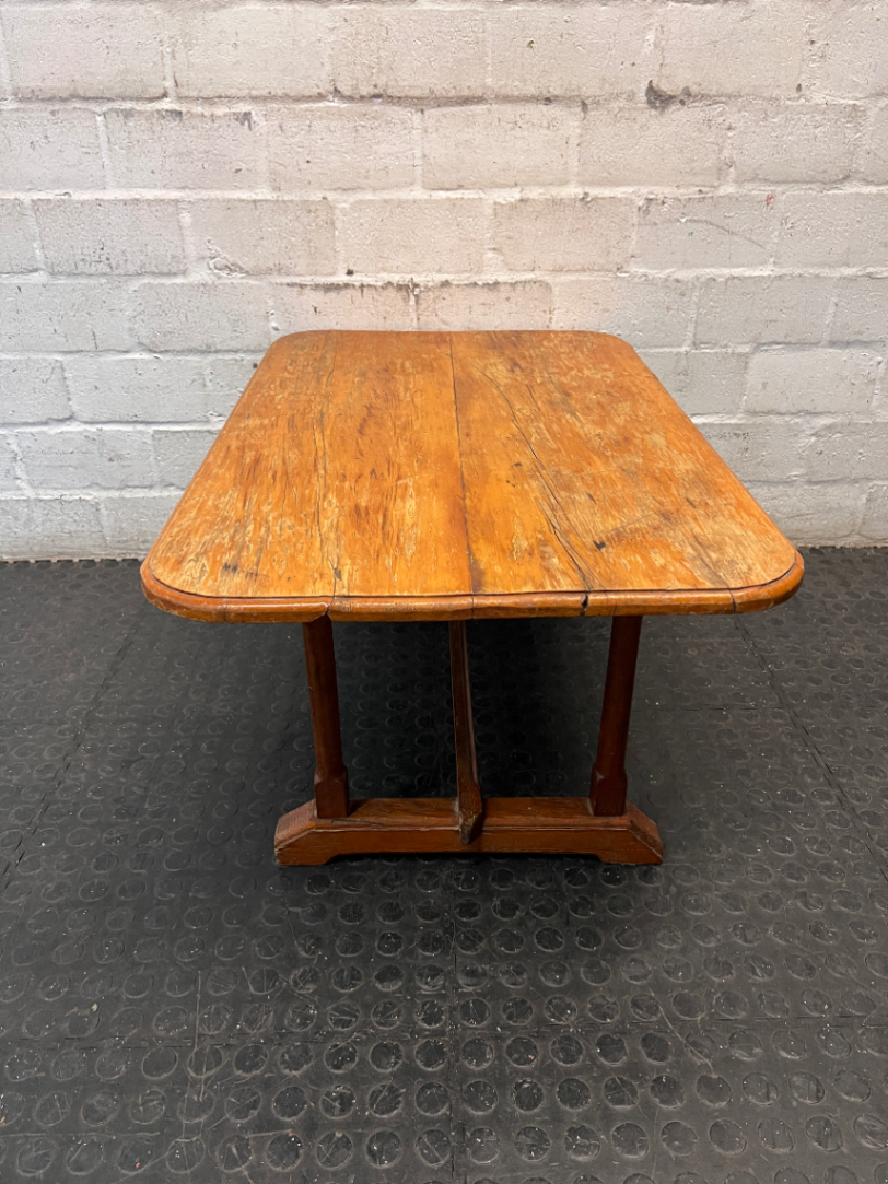Rectangular Wooden Trestle Coffee Table — Heavy Surface Scratches and Worn Varnish