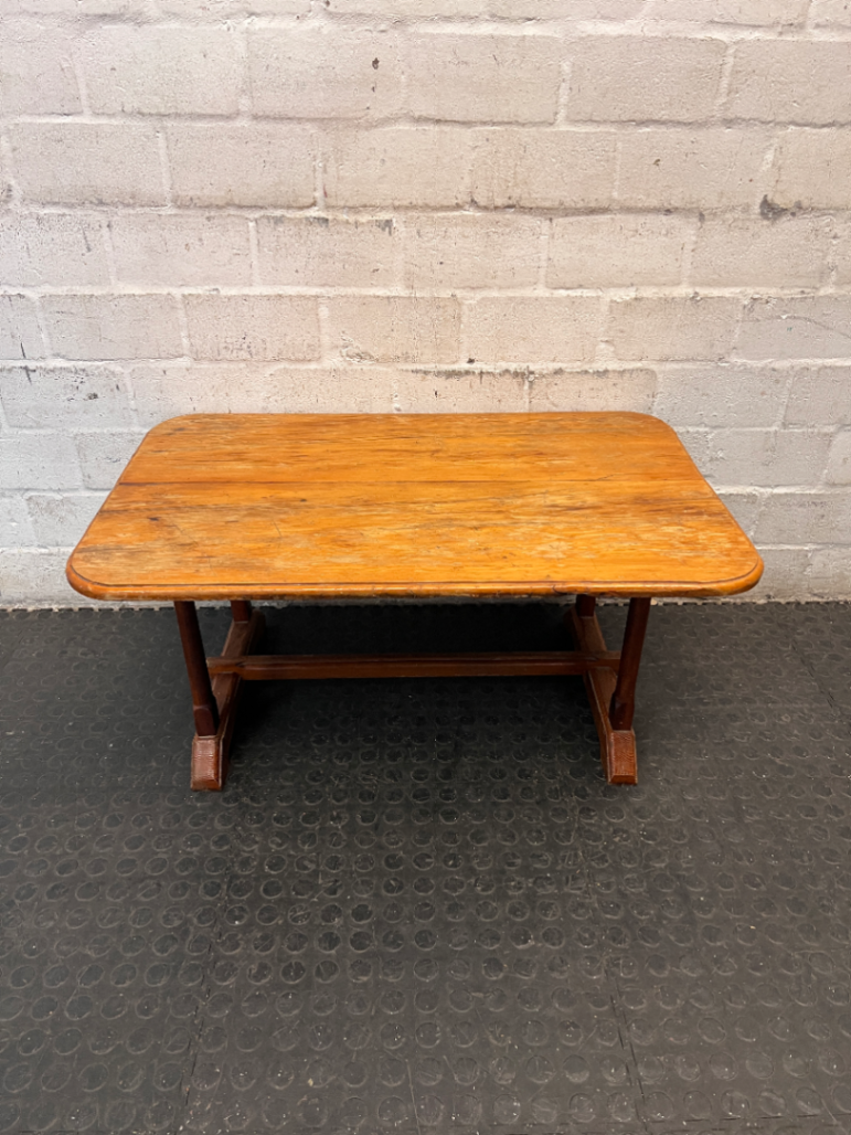Rectangular Wooden Trestle Coffee Table — Heavy Surface Scratches and Worn Varnish