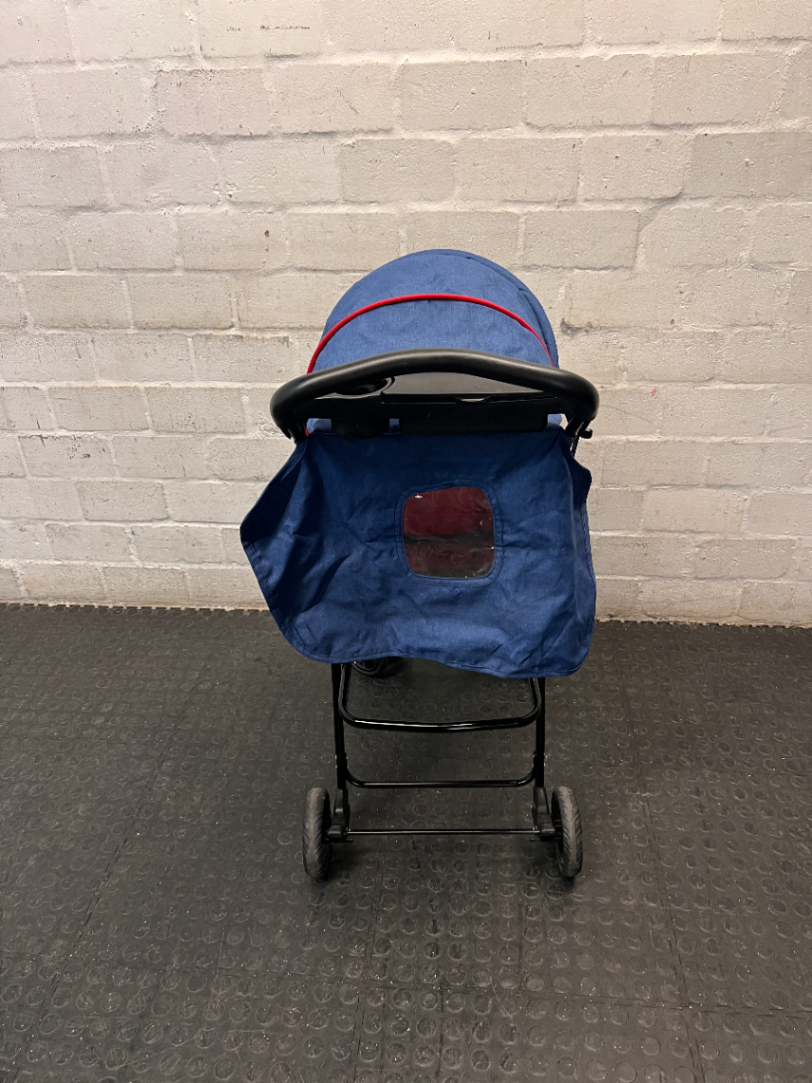 Red and Navy Four-Wheel Stroller with Snack Tray — Fair Condition with Signs of Use