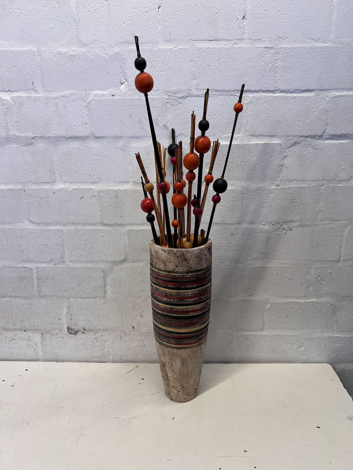 Rustic Striped Vase with Beaded Decorative Sticks