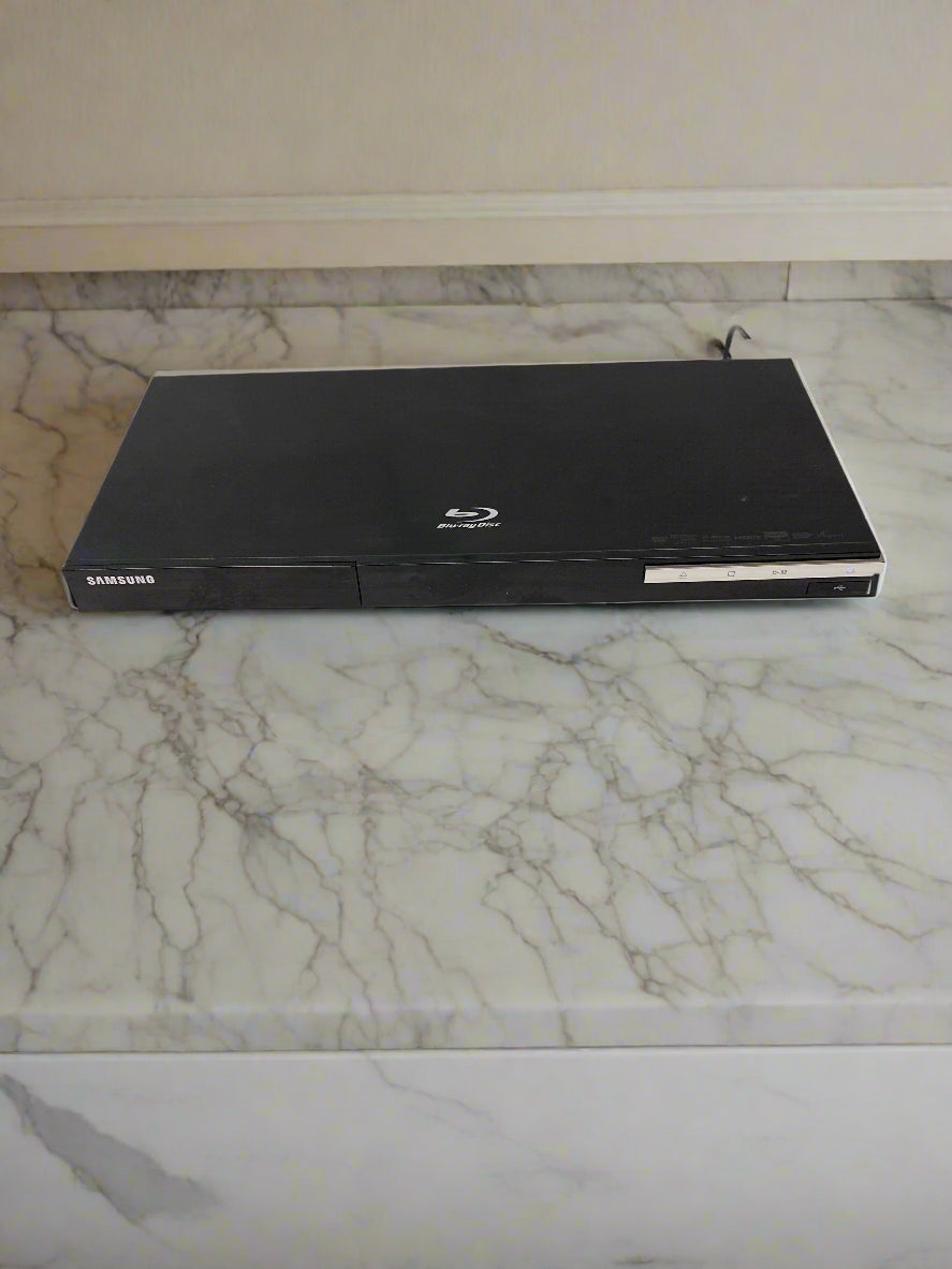 Samsung Blu-ray player on a marble countertop