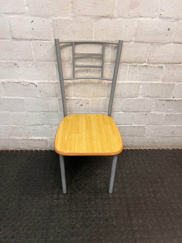 Silver Metal Dining Chair with Wood-Effect Seat — Visible Surface Wear and Scuffing