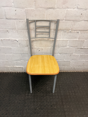 Silver Metal Dining Chair with Wood-Effect Seat — Visible Surface Wear and Scuffing
