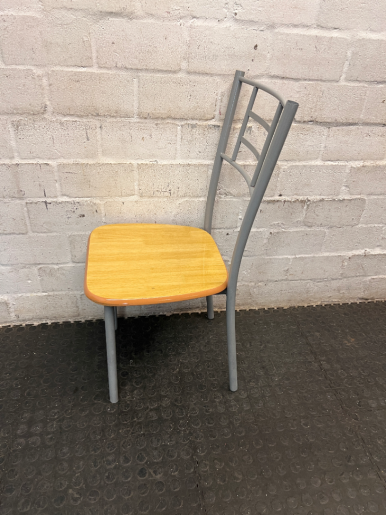 Silver Metal Dining Chair with Wood-Effect Seat — Visible Surface Wear and Scuffing