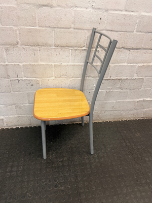 Silver Metal Dining Chair with Wood-Effect Seat — Visible Surface Wear and Scuffing