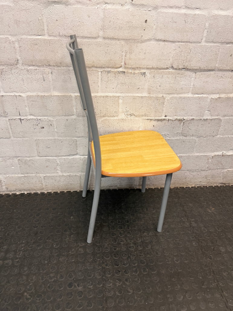 Silver Metal Dining Chair with Wood-Effect Seat — Visible Surface Wear and Scuffing