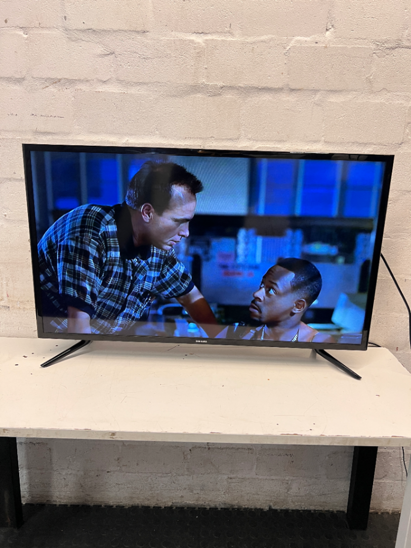 Sleek Black Flat Screen LED Television with Stand — Working Well; Heavily Used Condition