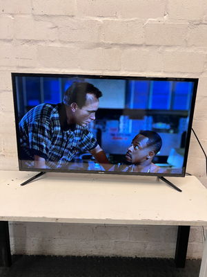Sleek Black Flat Screen LED Television with Stand — Working Well; Heavily Used Condition