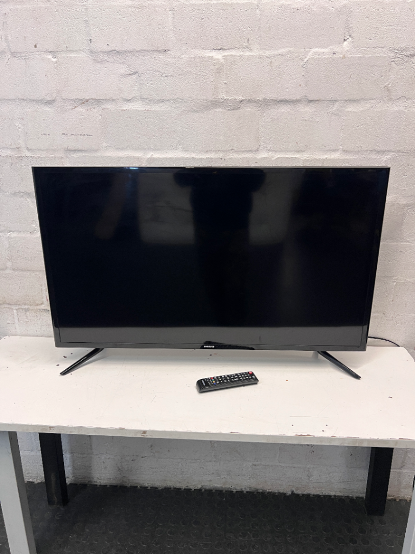 Sleek Black Flat Screen LED Television with Stand — Working Well; Heavily Used Condition