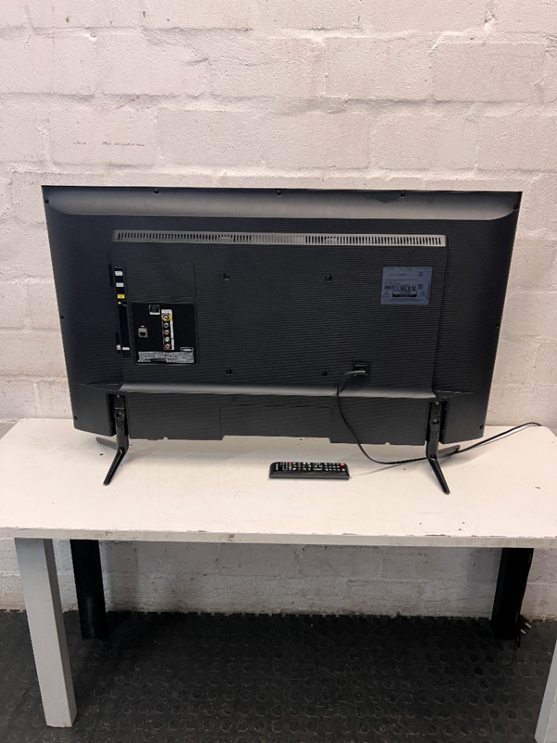 Sleek Black Flat Screen LED Television with Stand — Working Well; Heavily Used Condition