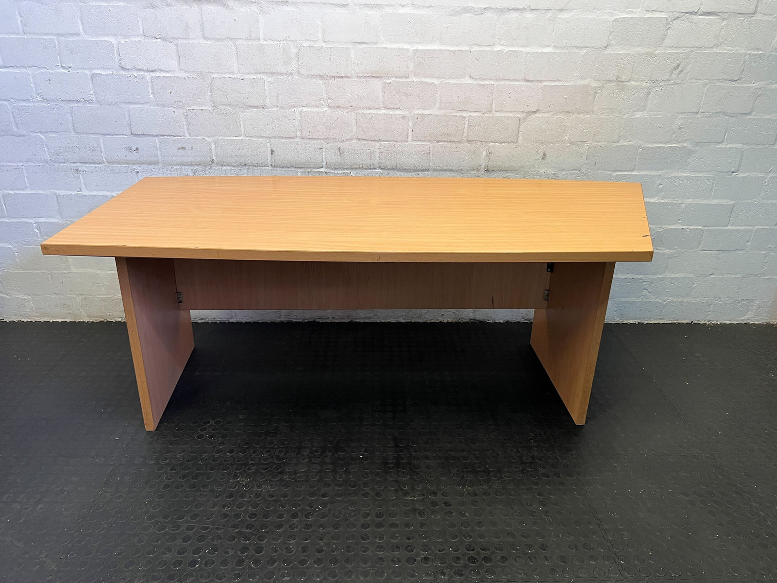 Sleek Light Wood Desk with Minor Scratches – Ideal Workstation