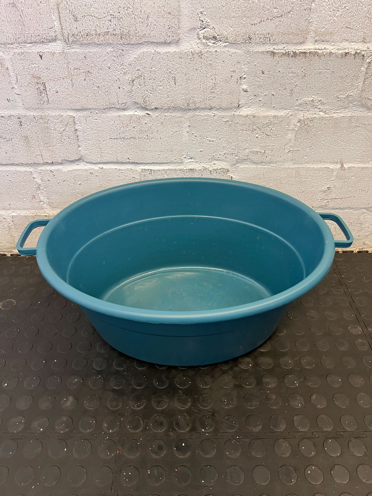 Spacious Turquoise Plastic Utility Tub with Minor Scratches
