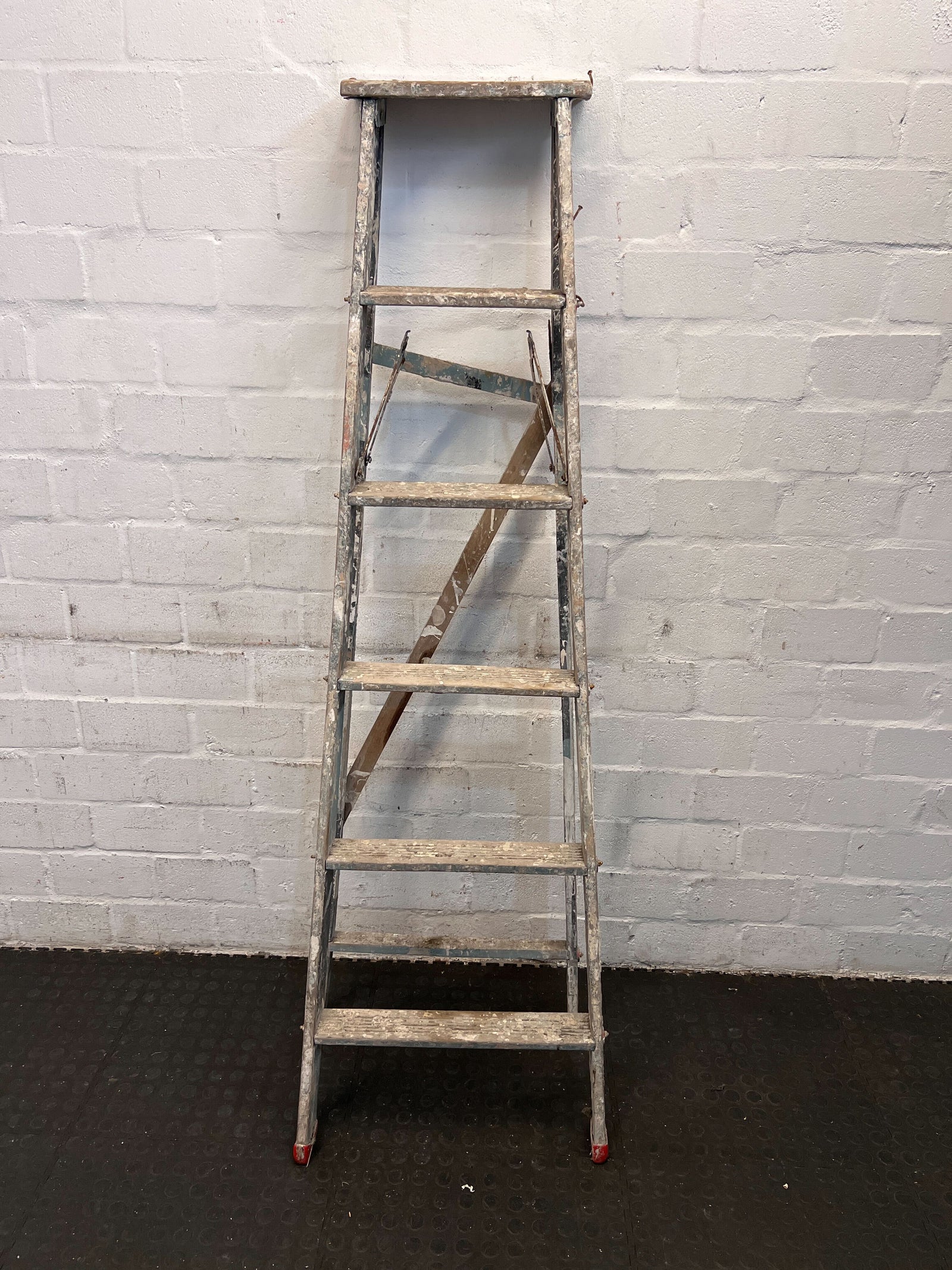 Sturdy 6-Step Aluminum Ladder with Minor Paint Stains
