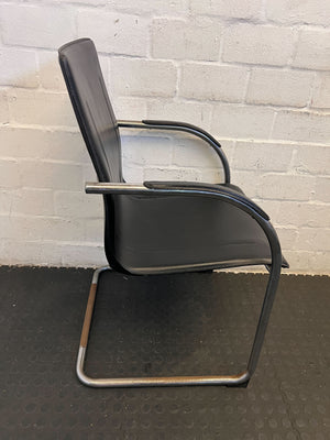 Stylish Black Leather Chair with Chrome Frame – Vintage Appeal Some Rust