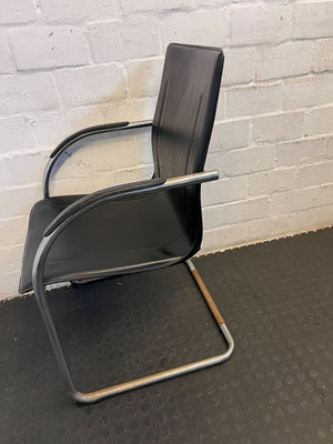 Stylish Black Leather Chair with Chrome Frame – Vintage Appeal Some Rust