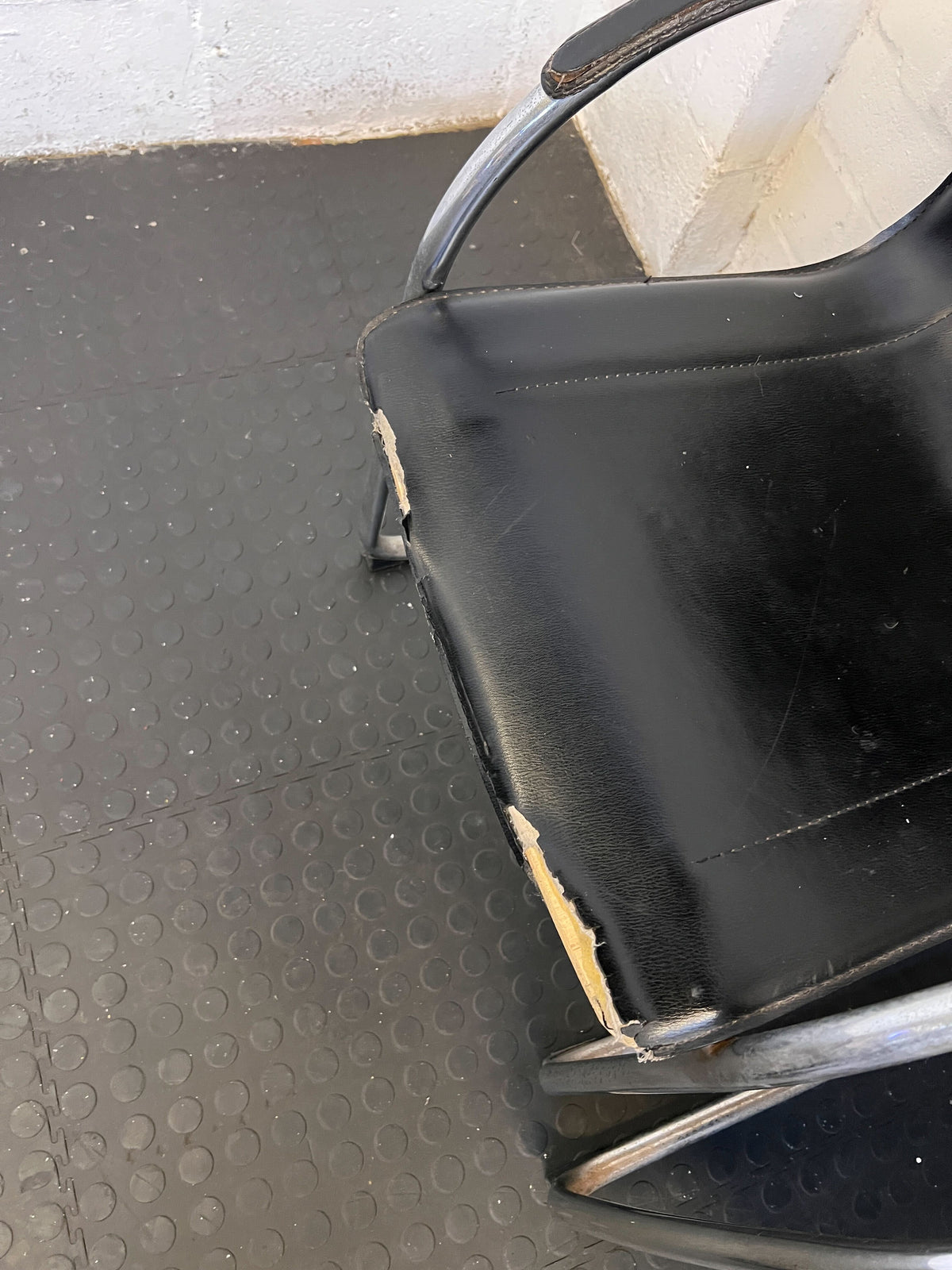 Stylish Black Leather Chair with Chrome Frame – Vintage Appeal Some Rust