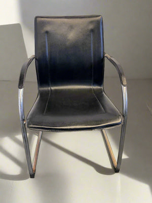 Stylish Black Leather Chair with Chrome Frame – Vintage Appeal Some Rust